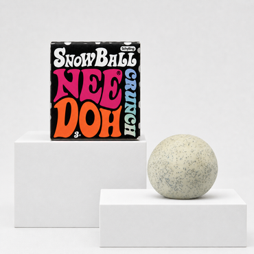 NeeDoh Snowball Crunch squishy fidget toy with retail package on white rectangular podiums