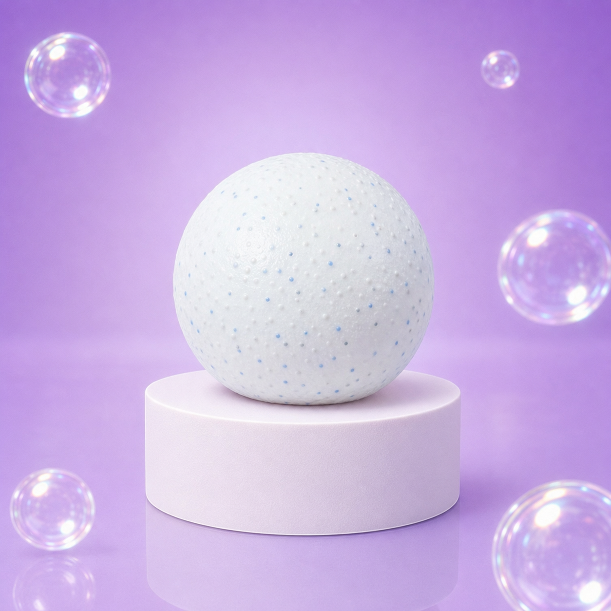 White NeeDoh Snowball Crunch textured squishy fidget toy on a white podium.