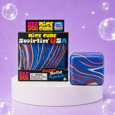 NeeDoh Nice Cube Swirlin USA package with a red, white, and blue marbled rounded cube on a white podium.