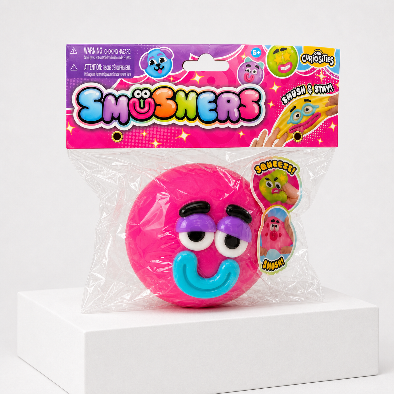 Hot Pink ORB Curiosities Smushers Squishy Toy in retail packaging