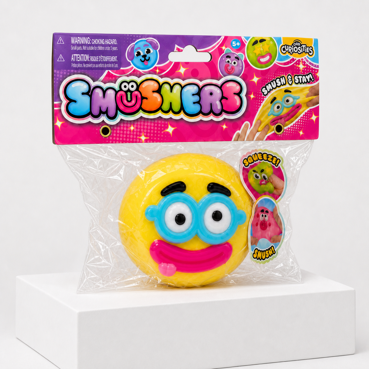 Yellow ORB Curiosities Smushers Squishy Toy in retail packaging