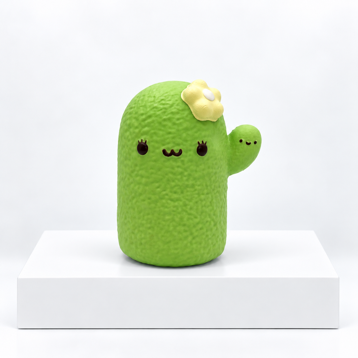 Green Nunu cactus character with yellow flower, unboxed front view