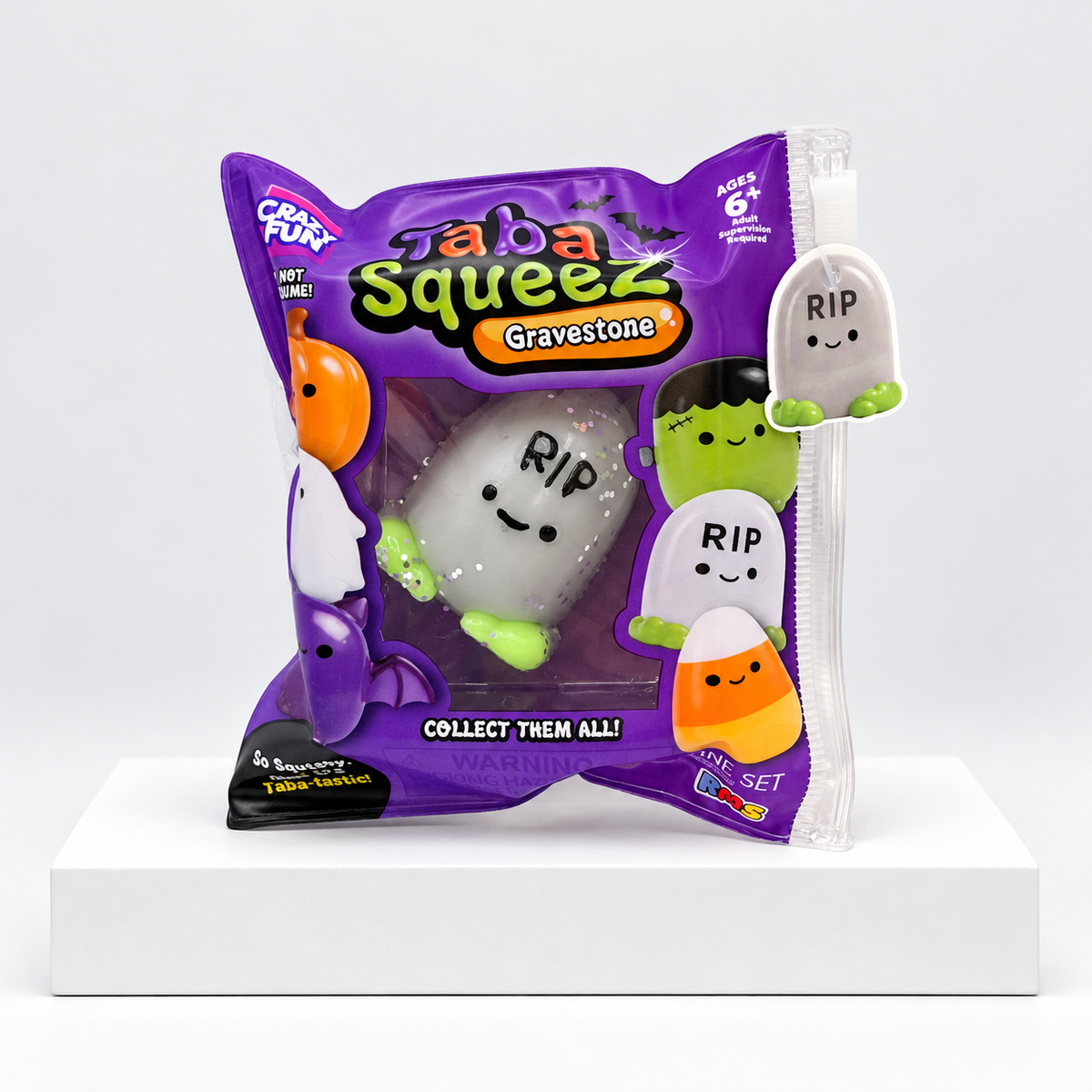 Purple Halloween Taba Squeez bag with gray gravestone-shaped toy inside