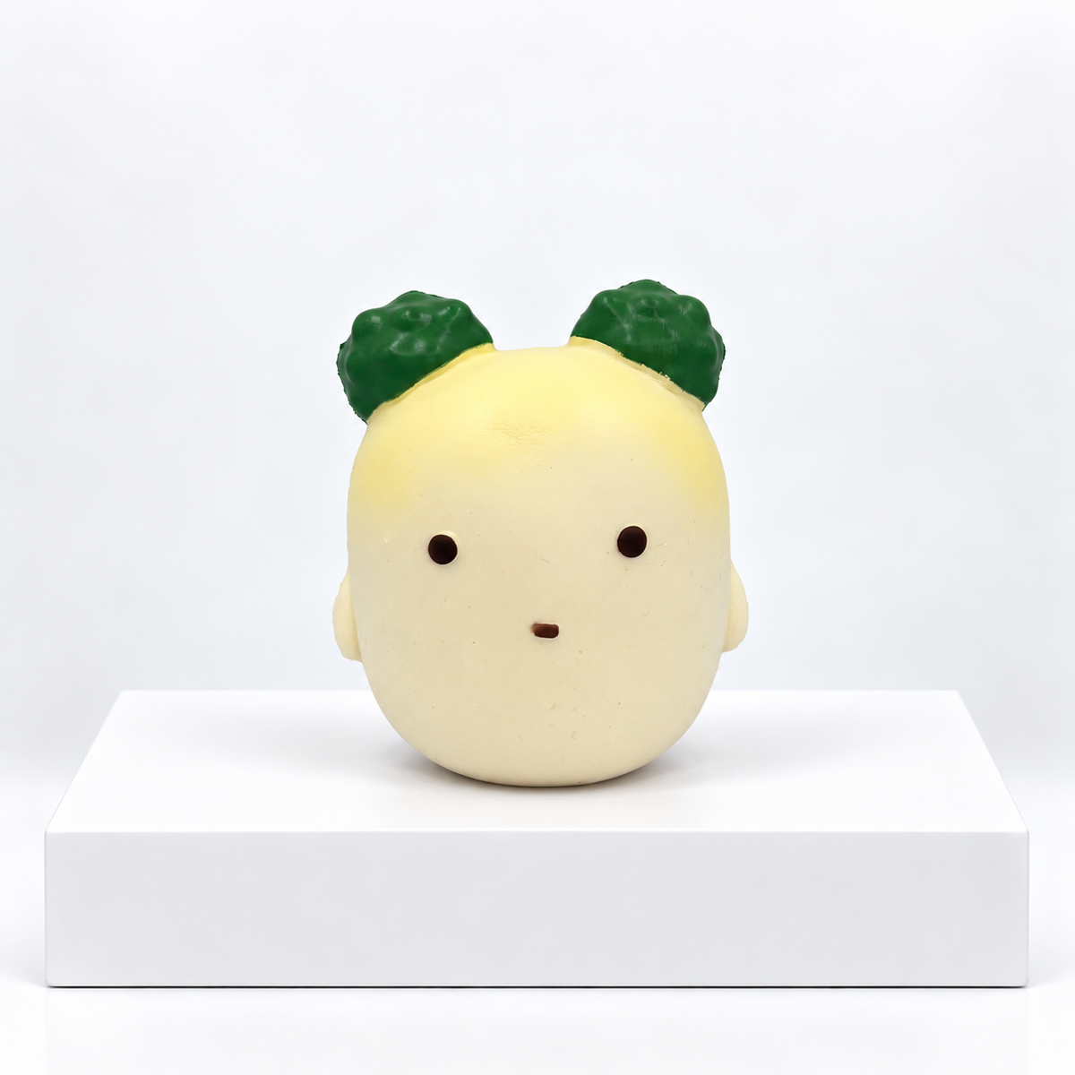Pale yellow Nunu radish character with dark green leaves, unboxed front view