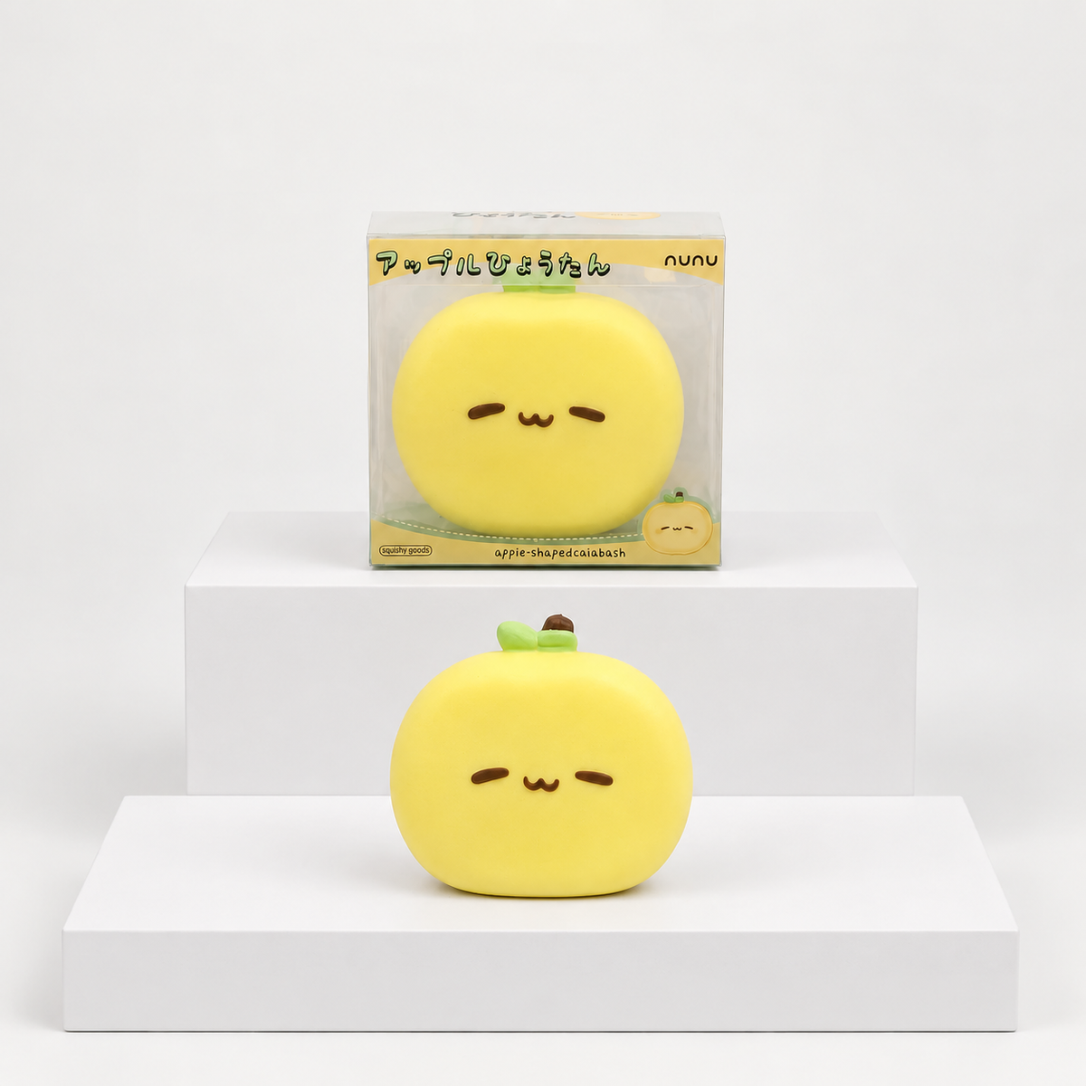 Yellow round Nunu character with face and green stem pictured beneath its box