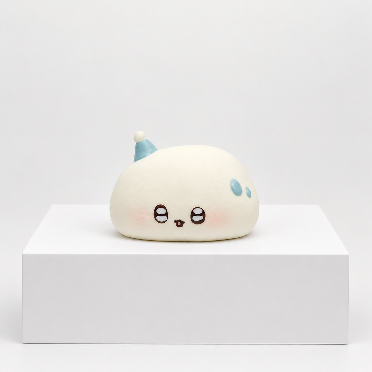 White Nunu cloud character with blue details, unboxed on white display