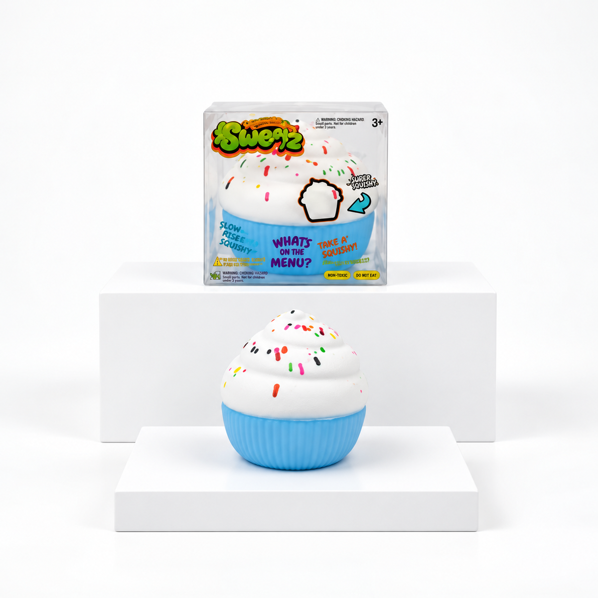 White sprinkle cupcake squishy with blue base displayed in front of its box