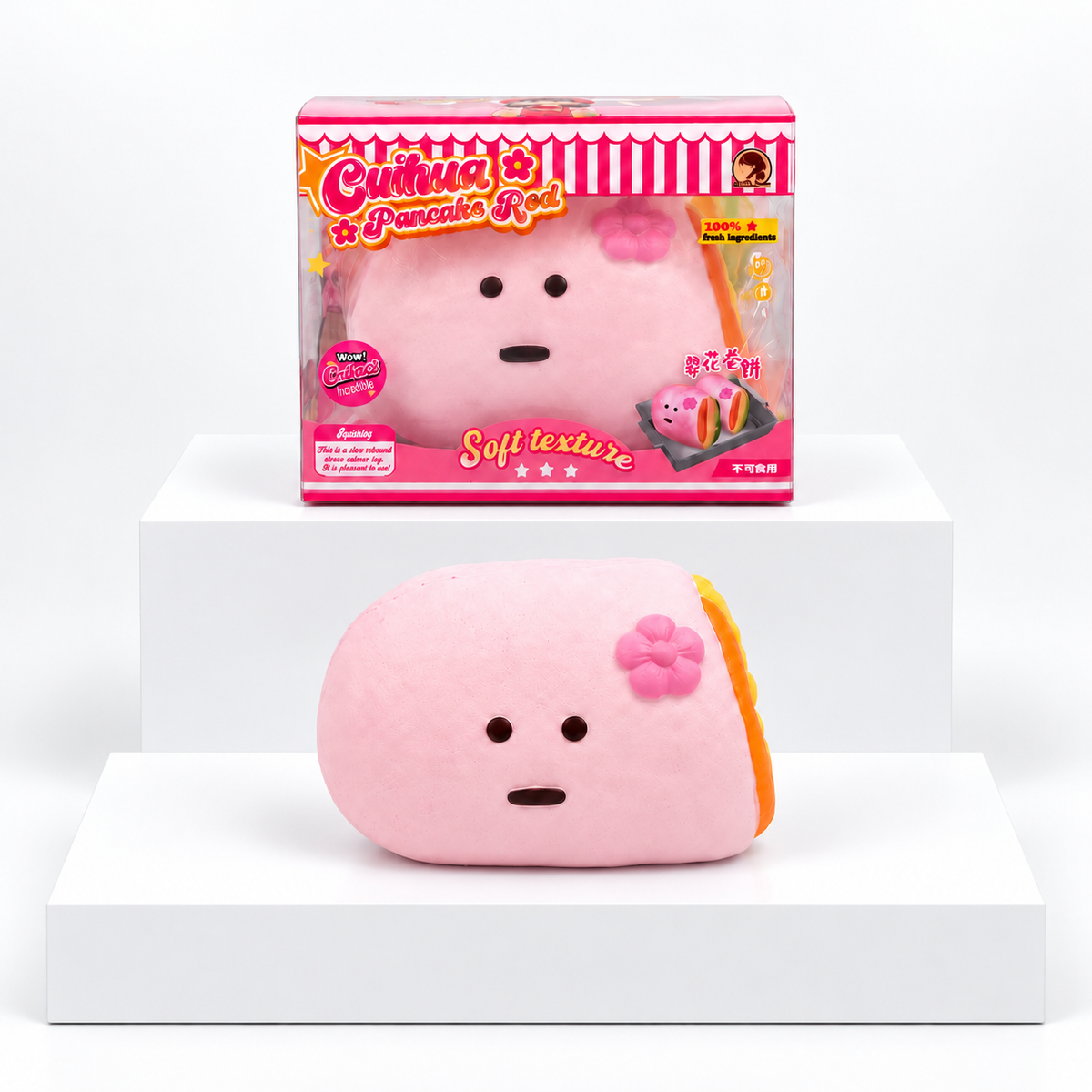 Pink Dudo crepe-shaped character with flower pictured beneath its pink box