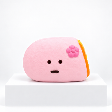Pink Dudo crepe-shaped character with flower, unboxed angled view