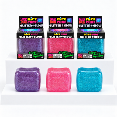 Purple, pink and blue glitter NeeDoh Nice Cubes in front of three display boxes