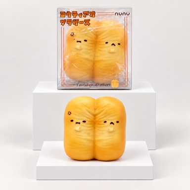 Two orange Nunu fried-dough characters pictured beneath their box