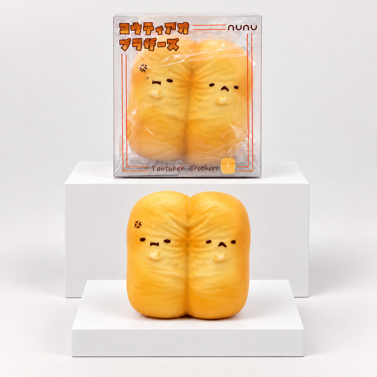 Two orange Nunu fried-dough characters pictured beneath their box