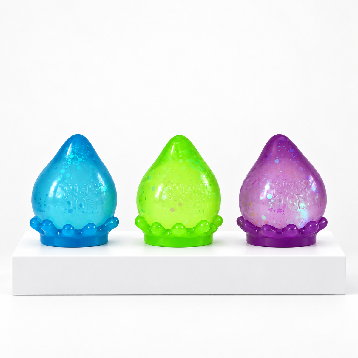Blue, green and purple NeeDoh Galactic Glow Dream Drop toys, unboxed group view