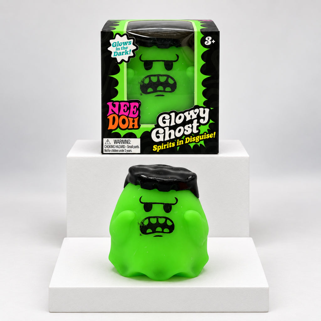 Green NeeDoh Glowy Ghost squishy in front of its box