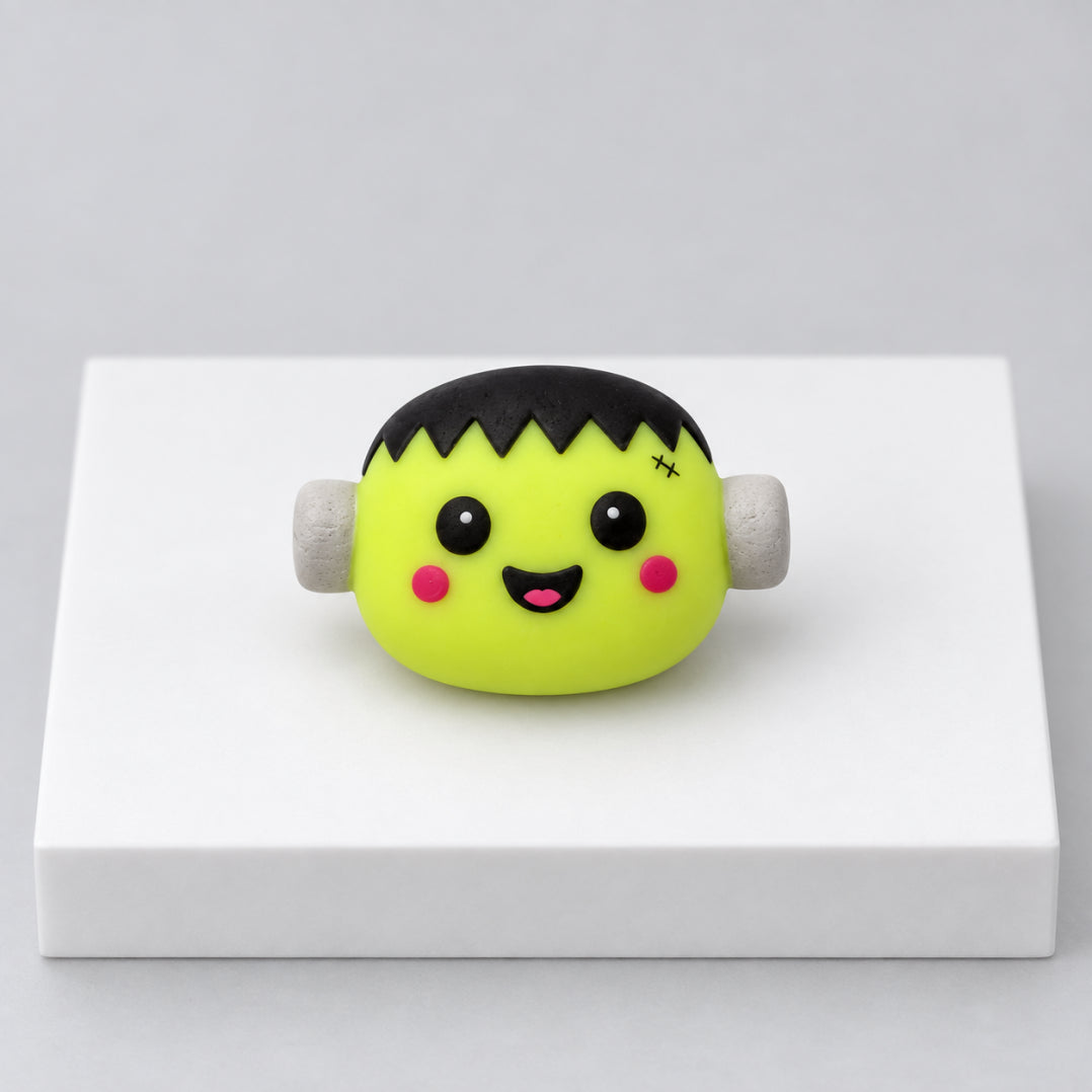 Green Frankenstein-inspired Halloween mochi with black hair