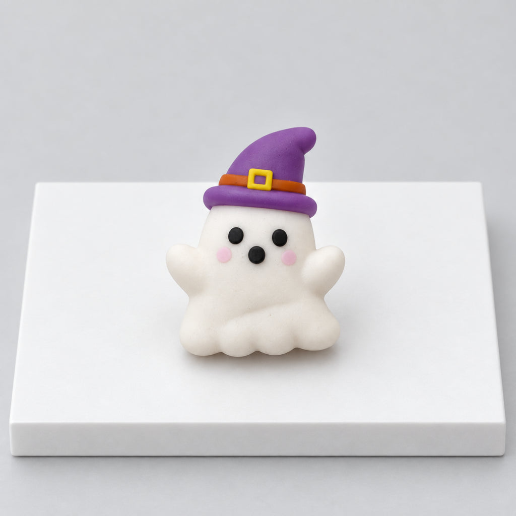 White ghost Halloween mochi wearing a purple witch hat