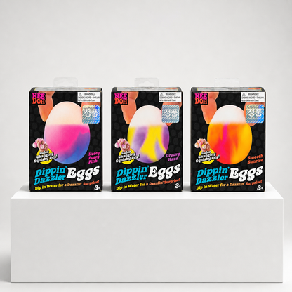 NeeDoh Dippin Dazzler Eggs packaging variants in Nosey Posey Pink, Groovy Haze, and Smooth Sunrise