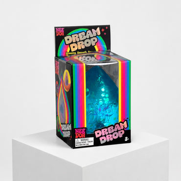 Squish Planet NeeDoh Dream Drop blue squishy fidget toy in its colourful retail packaging on a white pedestal.