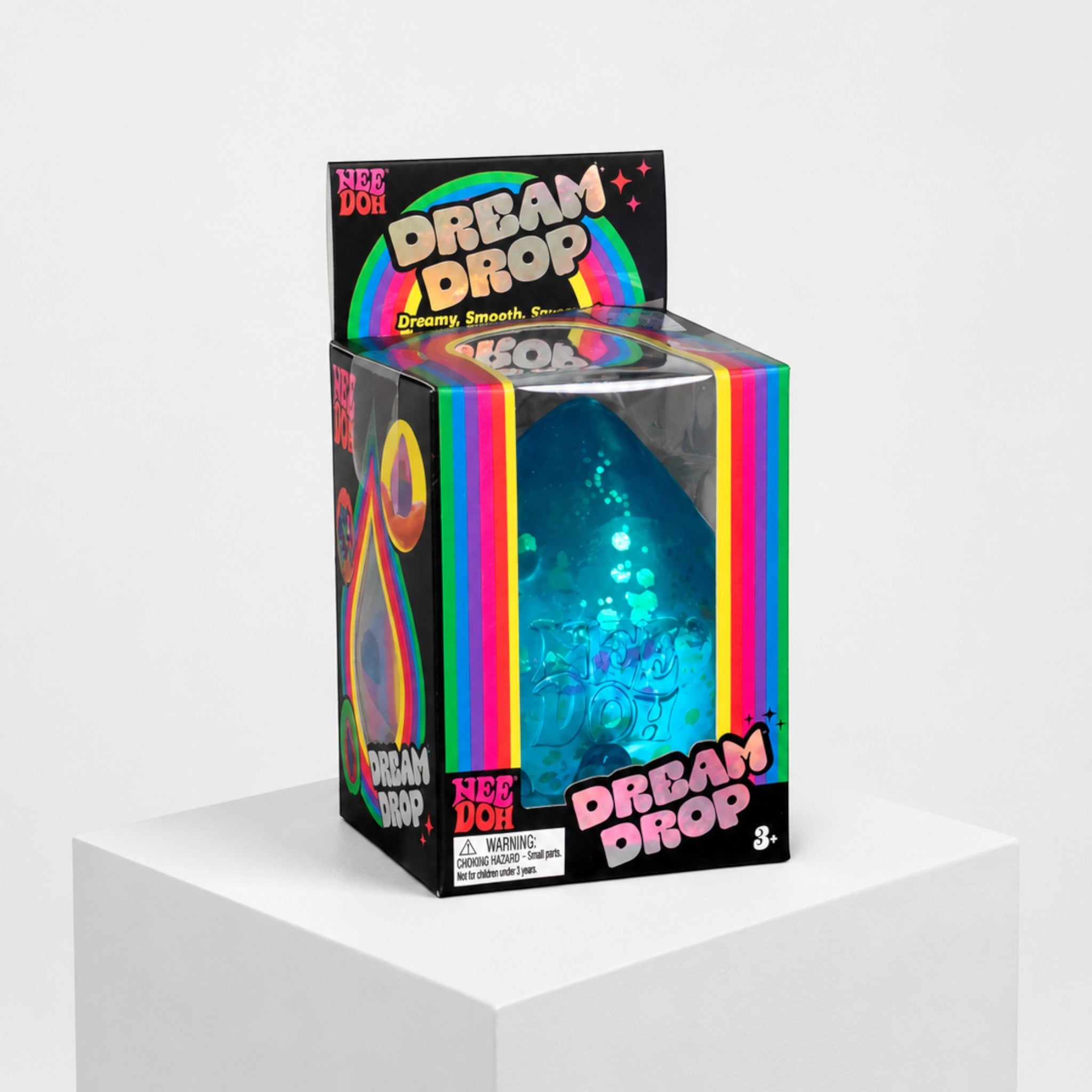 Squish Planet NeeDoh Dream Drop blue squishy fidget toy in its colourful retail packaging on a white pedestal.