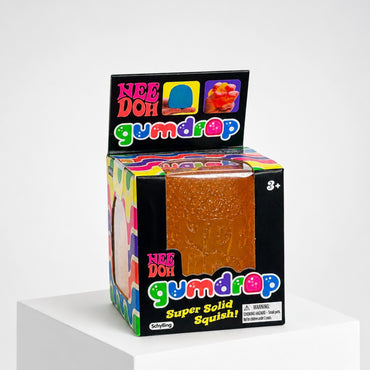 Squish Planet NeeDoh Gumdrop orange squishy fidget toy in its colorful candy-themed retail packaging box
