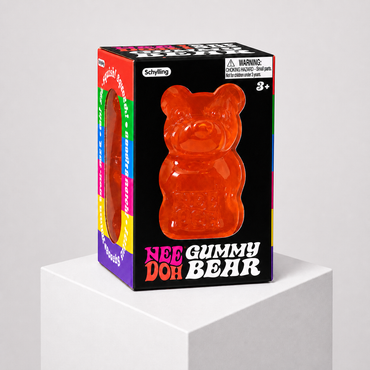 NeeDoh Gummy Bear orange squishy fidget toy in complete retail packaging, centered studio view.