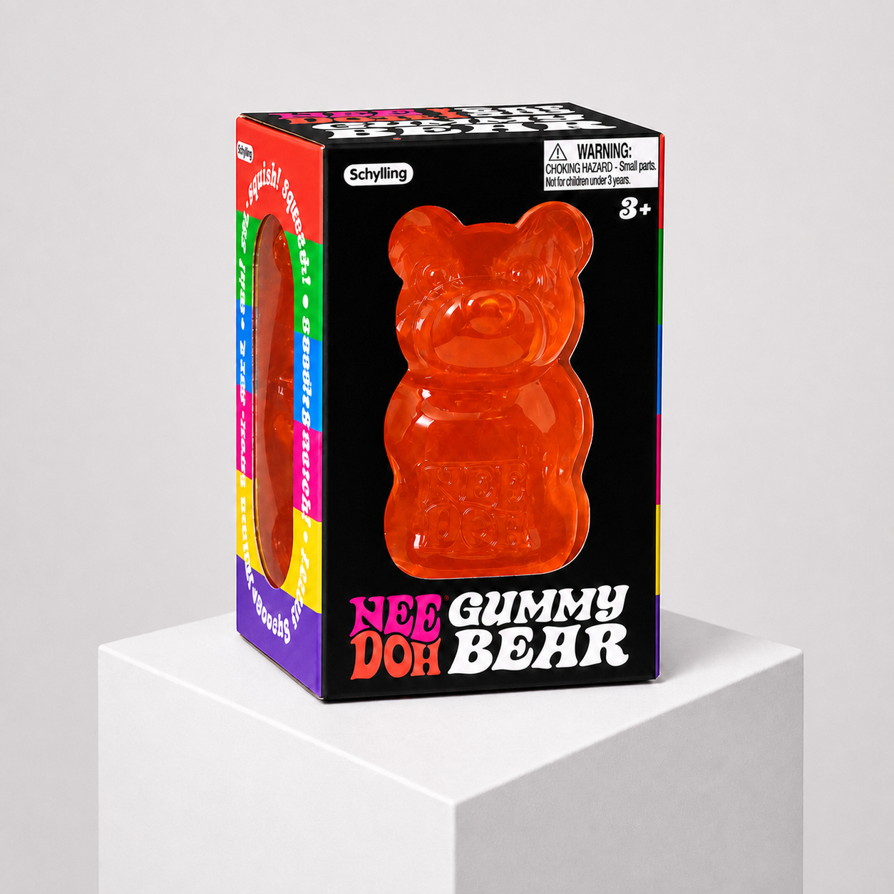 NeeDoh Gummy Bear orange squishy fidget toy in complete retail packaging, centered studio view.