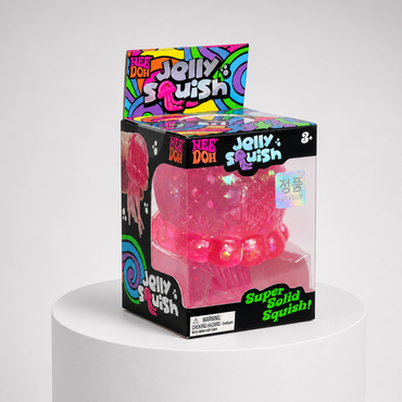 NeeDoh JellySquish pink glitter jellyfish squishy fidget toy in complete retail packaging, centered studio view.