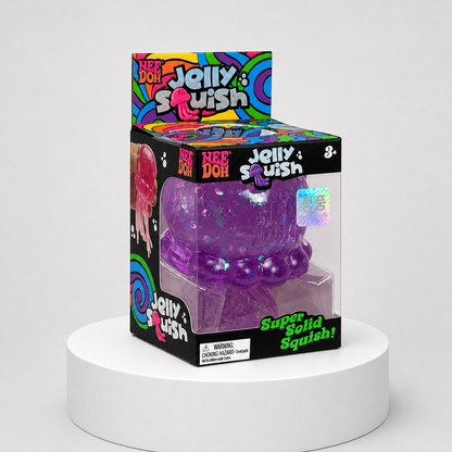NeeDoh JellySquish purple glitter jellyfish squishy fidget toy in complete retail packaging, centered studio view.