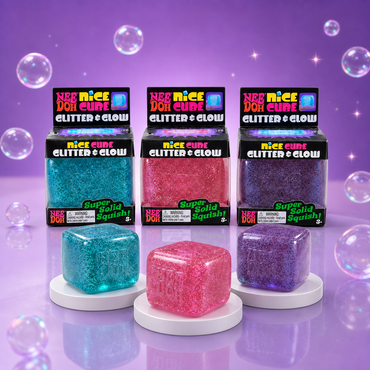 NeeDoh Nice Cube Glitter and Glow packaging with blue, pink, and purple glitter squishy cubes on a Squish Planet purple display.