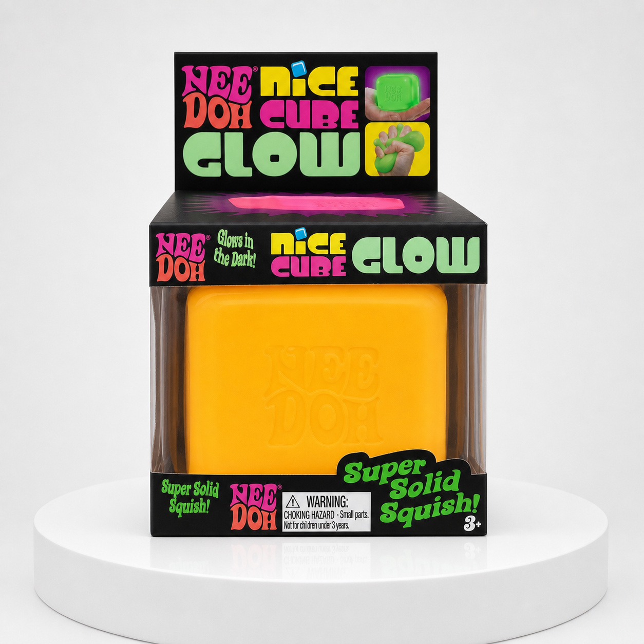 NeeDoh Nice Cube Glow yellow squishy fidget toy in retail packaging, front view.