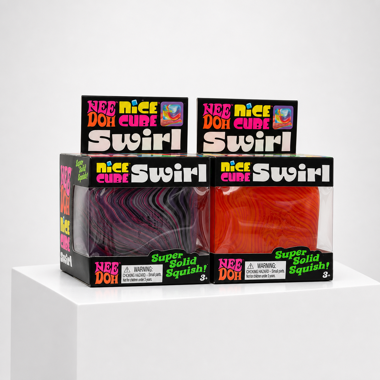 Two NeeDoh Nice Cube Swirl squishy fidget toys in colorful retail packaging, angled studio view.