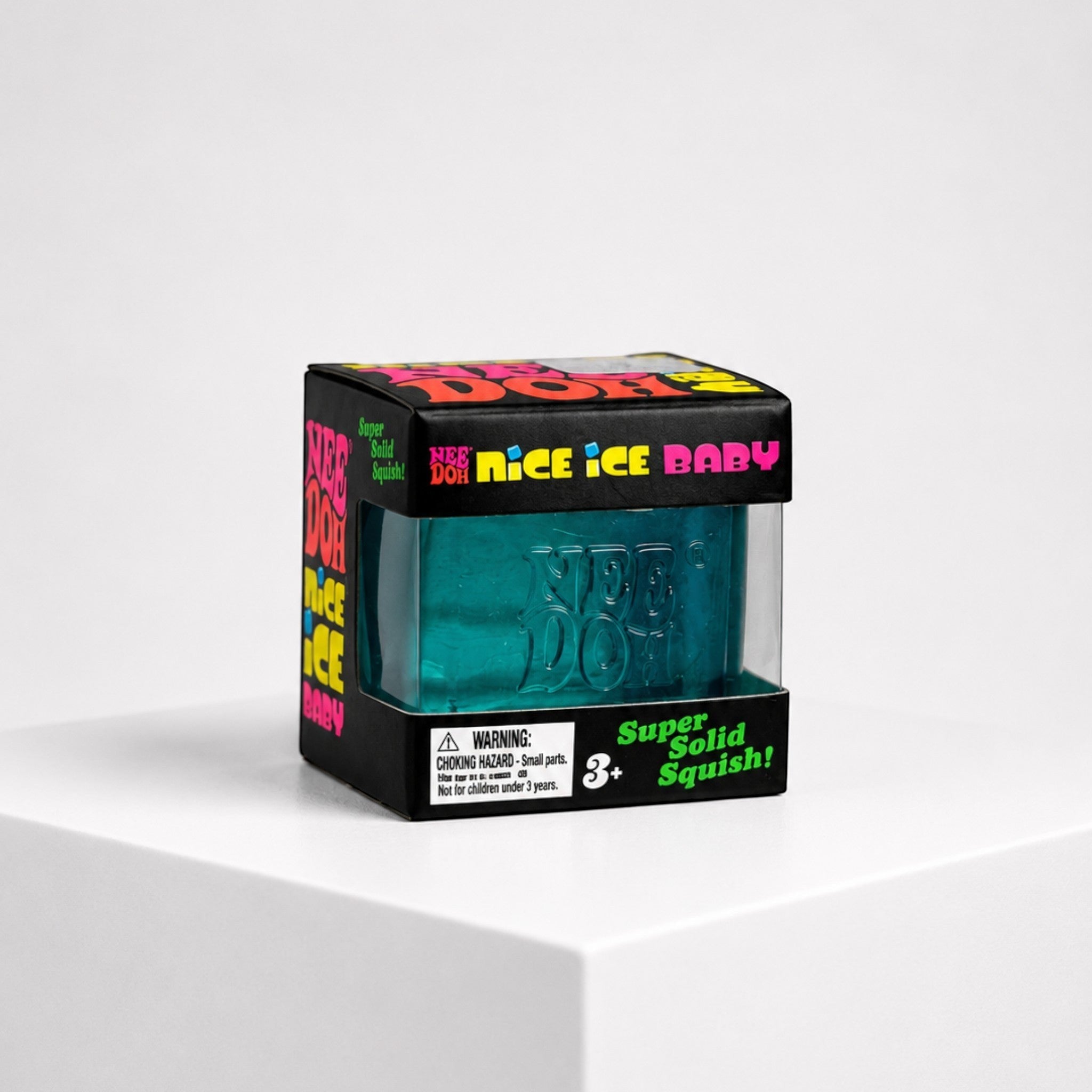 Squish Planet NeeDoh Nice Ice Baby blue cube fidget toy in its branded display box on a white pedestal.
