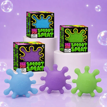 Squish Planet NeeDoh SplootSplat fidget toys in blue, purple, and green with matching display boxes on pedestals.