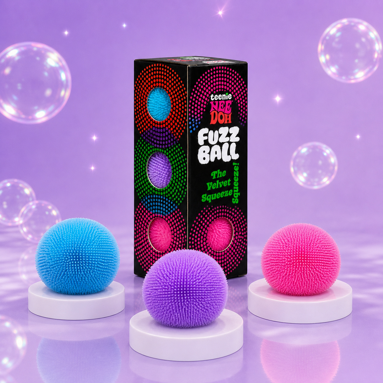 NeeDoh Teenie Fuzz Ball Pack of 3 with blue, purple, and pink squishy fidget toys on a Squish Planet purple display.