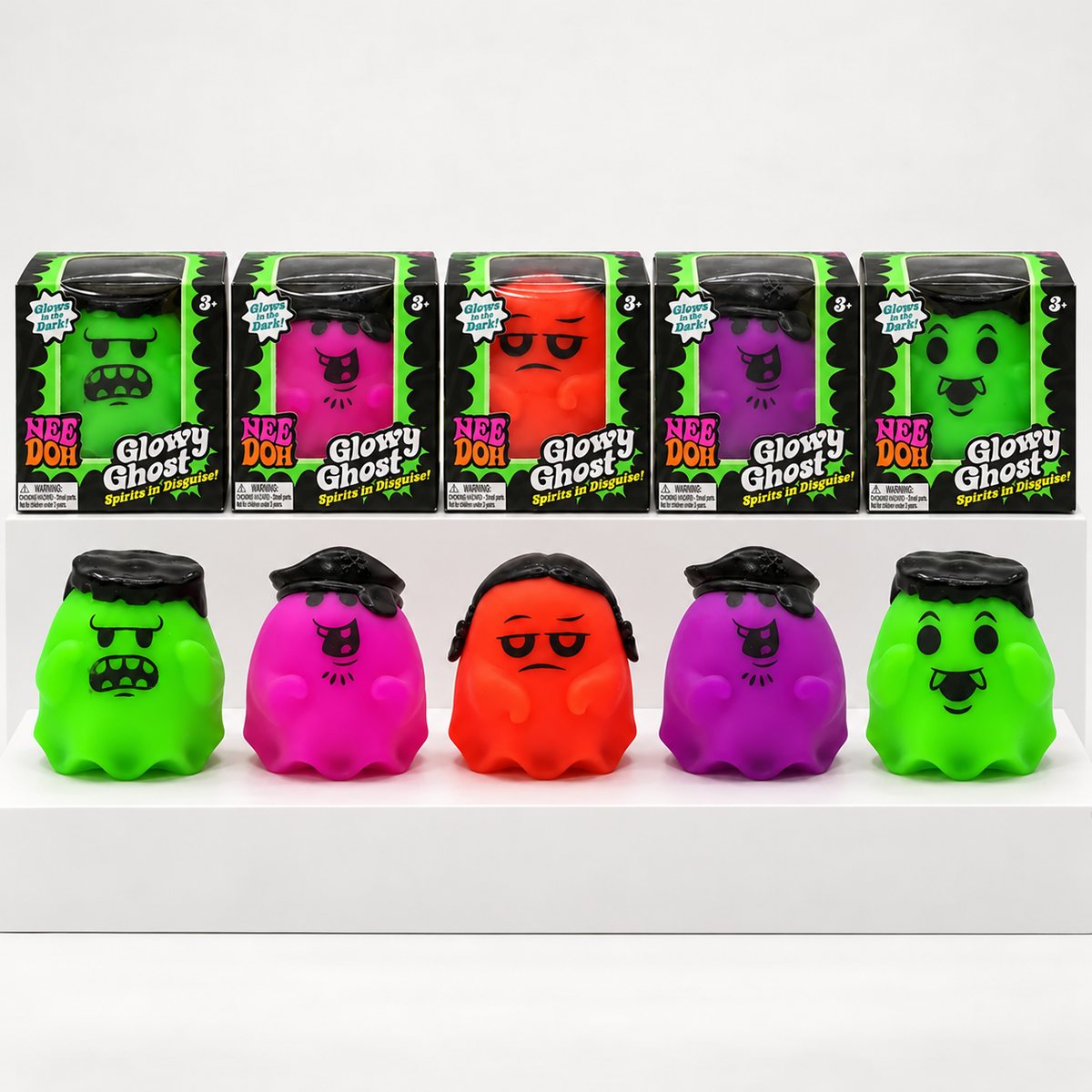 Five colourful NeeDoh Glowy Ghost toys below their individual boxes on white shelves