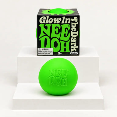 Green NeeDoh Glow in the Dark ball shown with its box