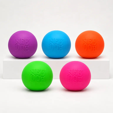 Five NeeDoh Glow in the Dark balls in pink, green, purple, orange and blue