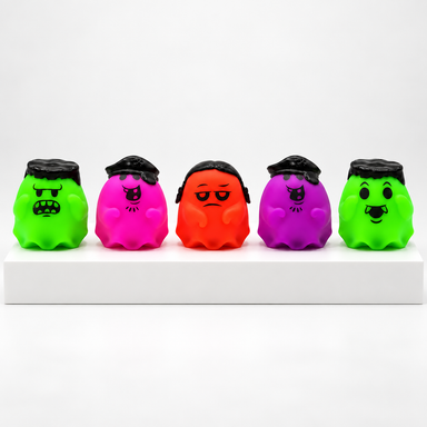 Five unboxed green, pink, orange and purple NeeDoh Glowy Ghost toys in a row