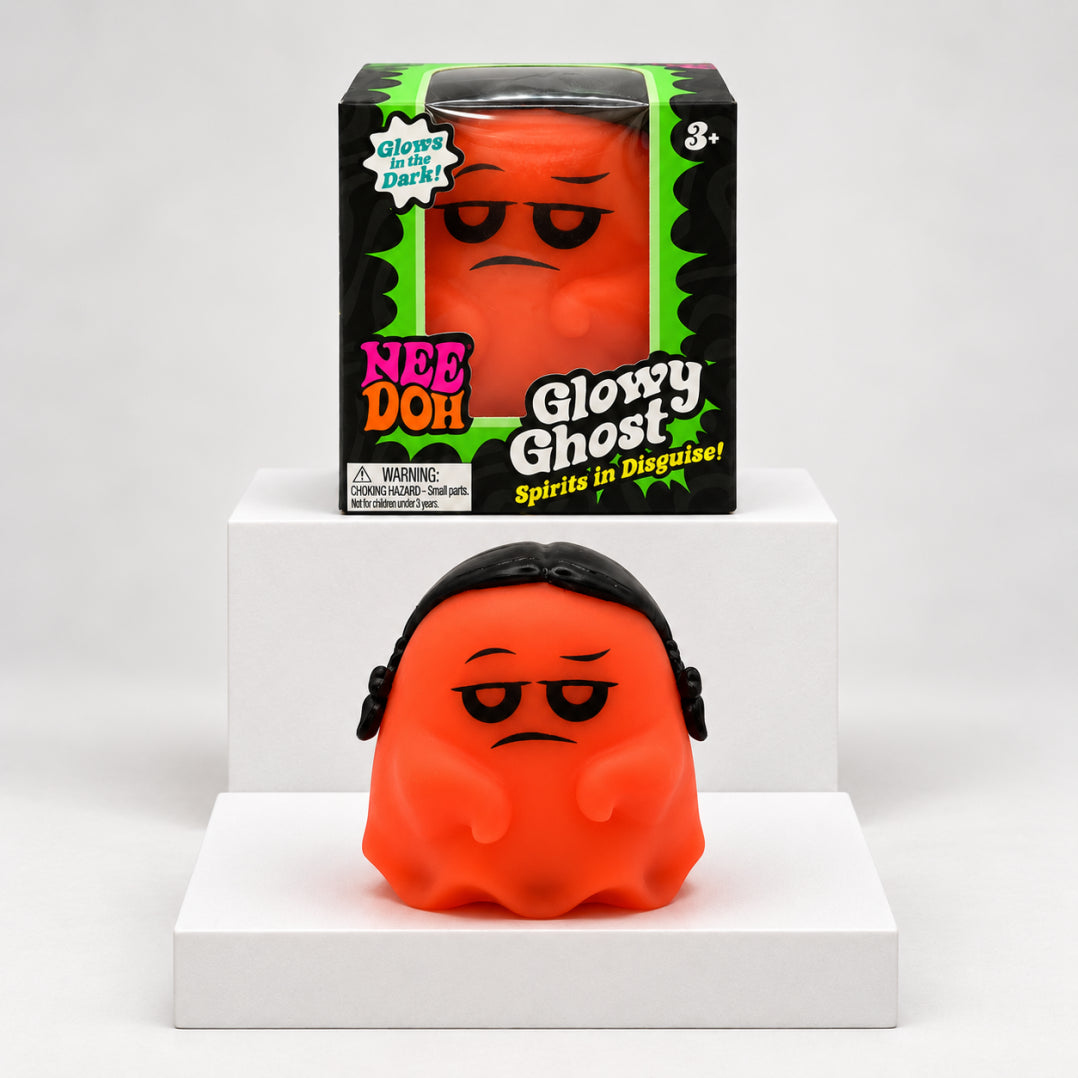 Orange NeeDoh Glowy Ghost squishy in front of its box