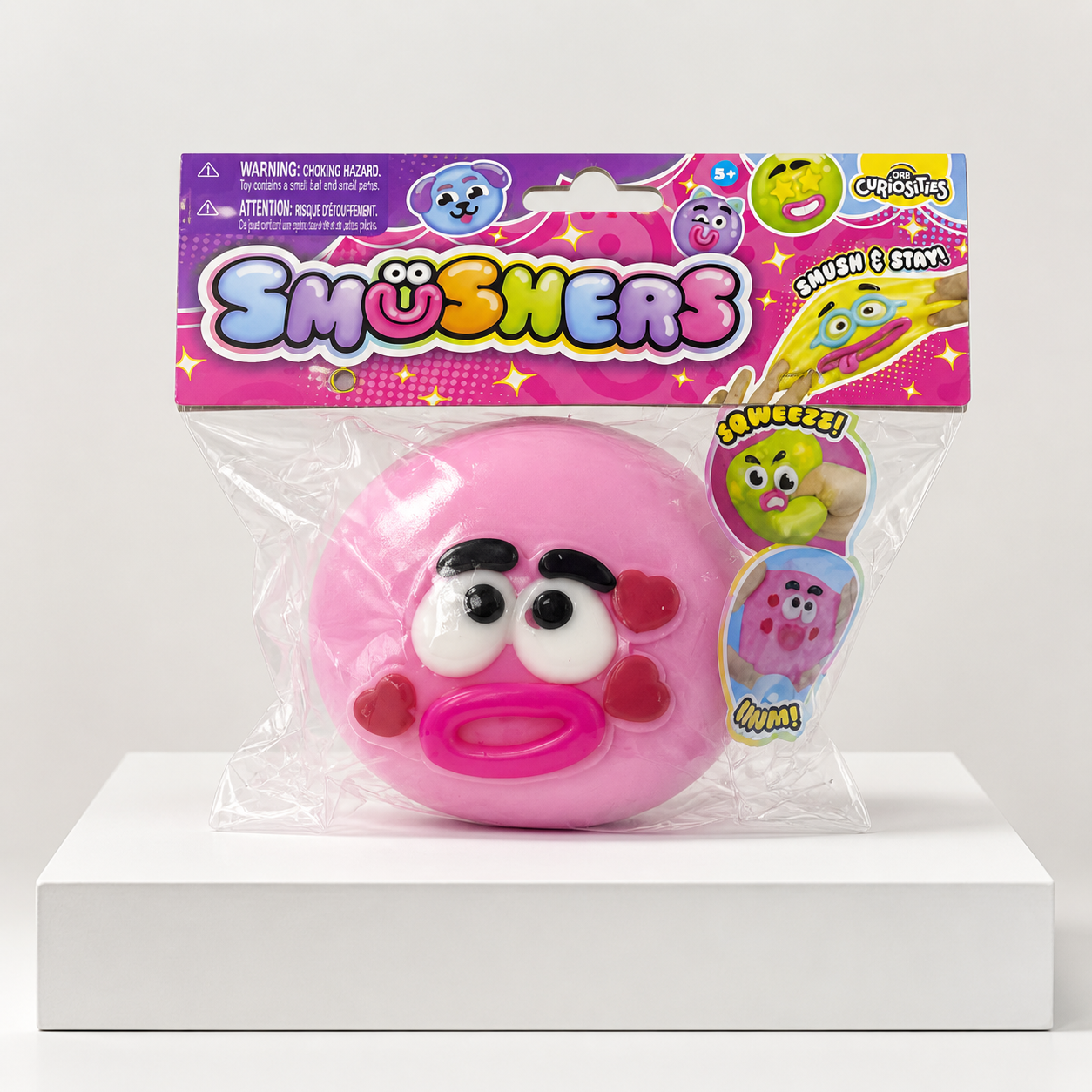 Light Pink ORB Curiosities Smushers Squishy Toy in centered retail packaging
