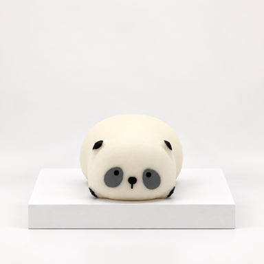Cream-colored panda-face Squeezy Snugglies squishy