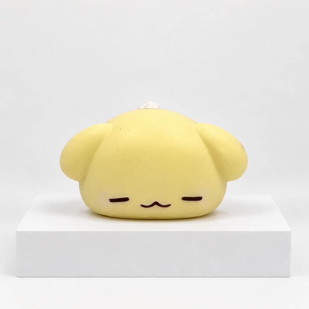 Cream-yellow Nunu puppy character lying down, front view