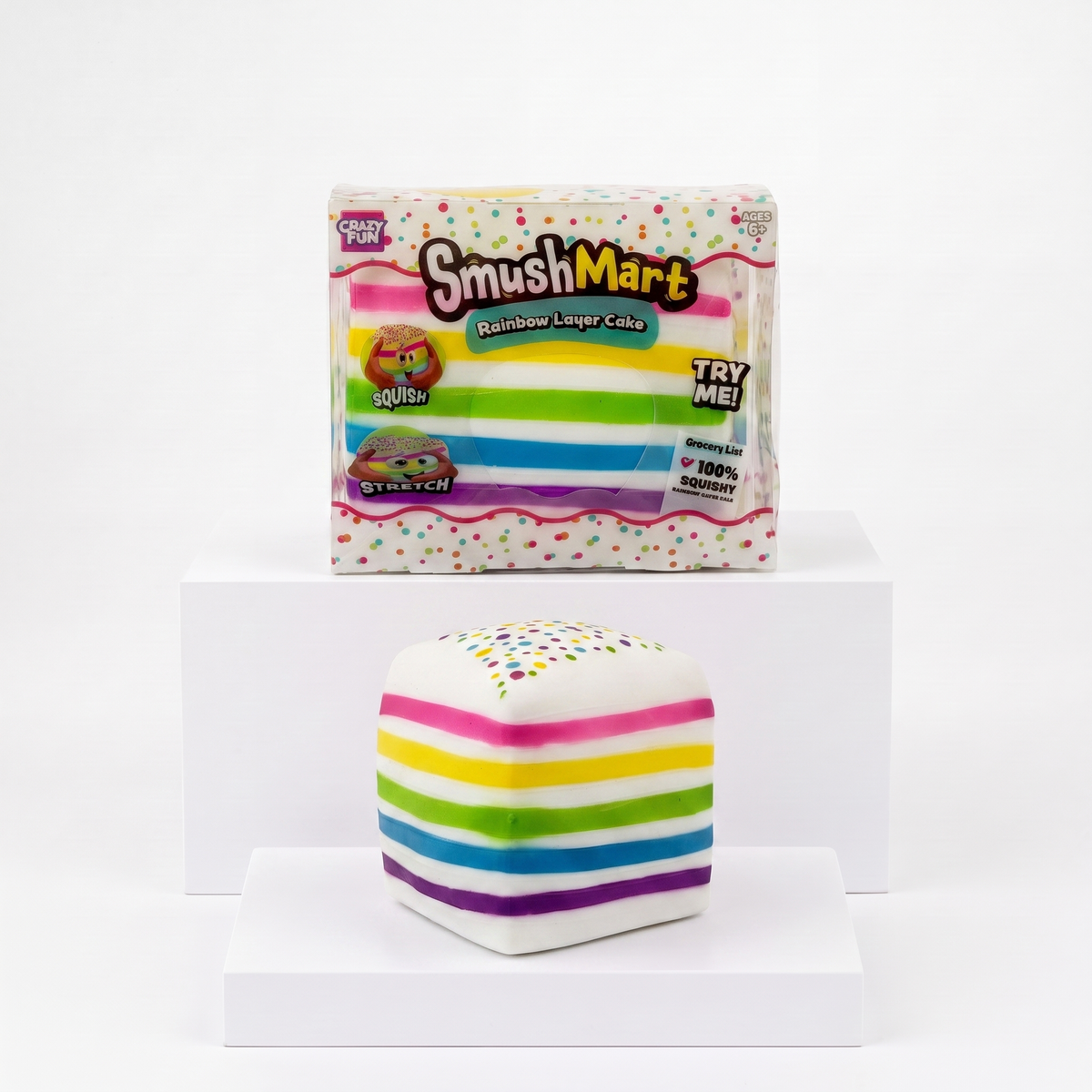 Crazy Fun Smush Mart Rainbow Layer Cake package with loose striped cake squishy toy
