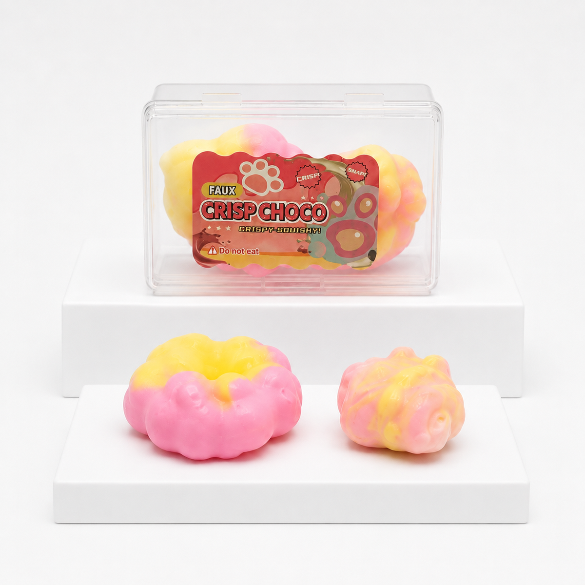 Pink Crisp Choco package with two loose pink-and-yellow rounded squish toys