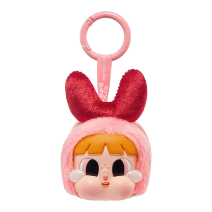 Squish Planet CryBaby x Powerpuff Girls plush toy with pink fur hood and red bow, featuring a vinyl face with large eyes and rosy cheeks.