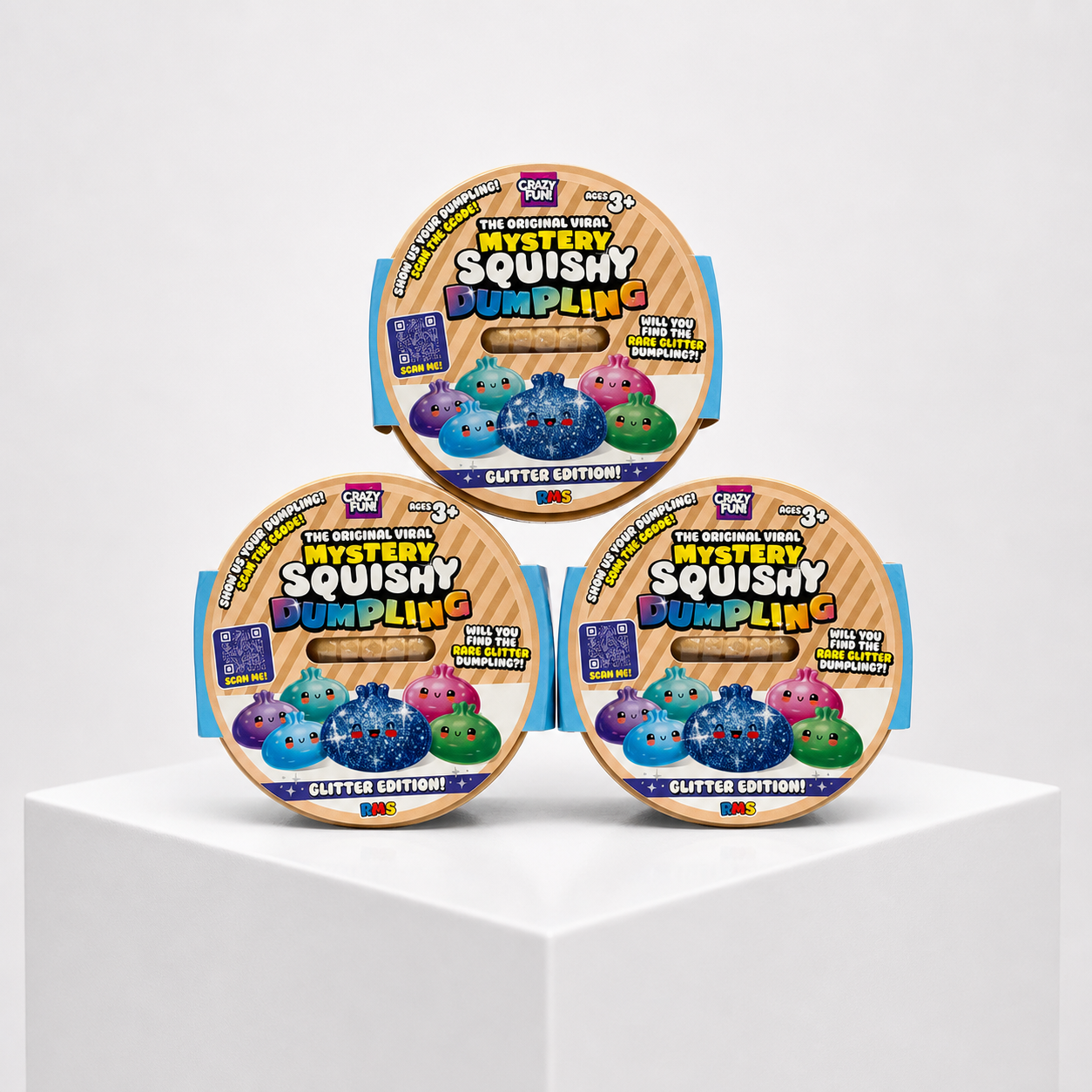 Crazy Fun Galaxy Glitter Mystery Squishy Dumpling blind boxes in a three-package studio display.