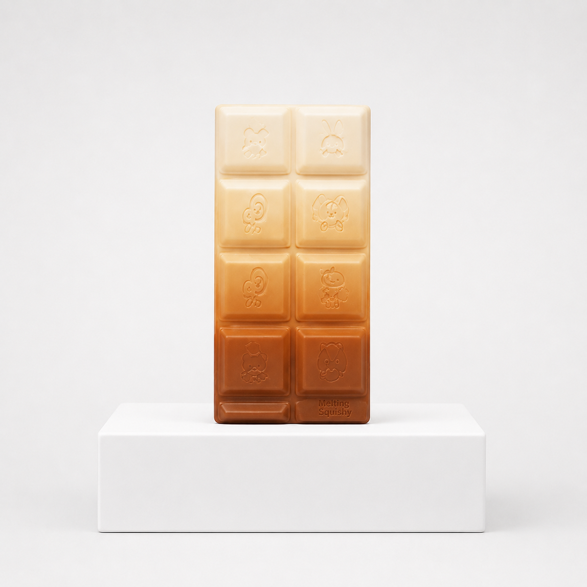Cream-to-brown gradient chocolate-bar squishy with embossed characters
