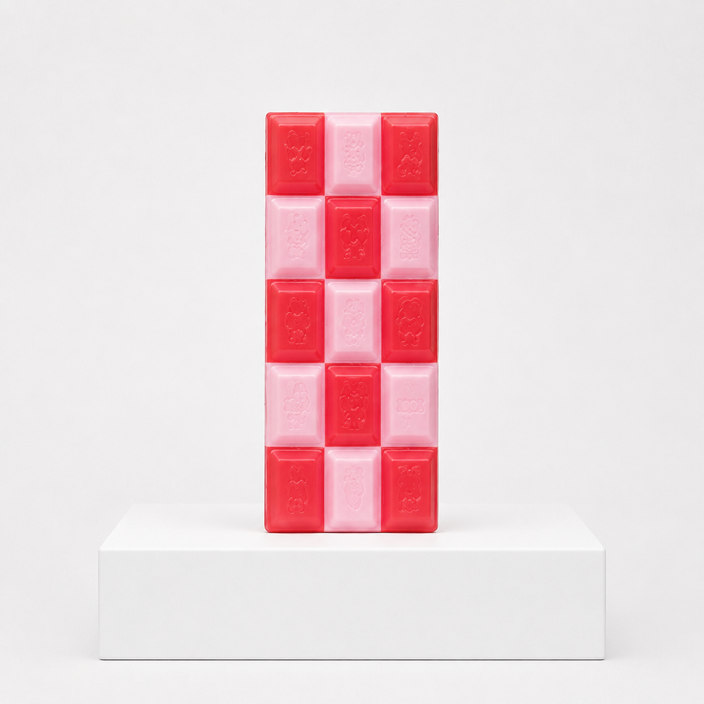Red and pale pink checkerboard chocolate-bar squishy with embossed characters