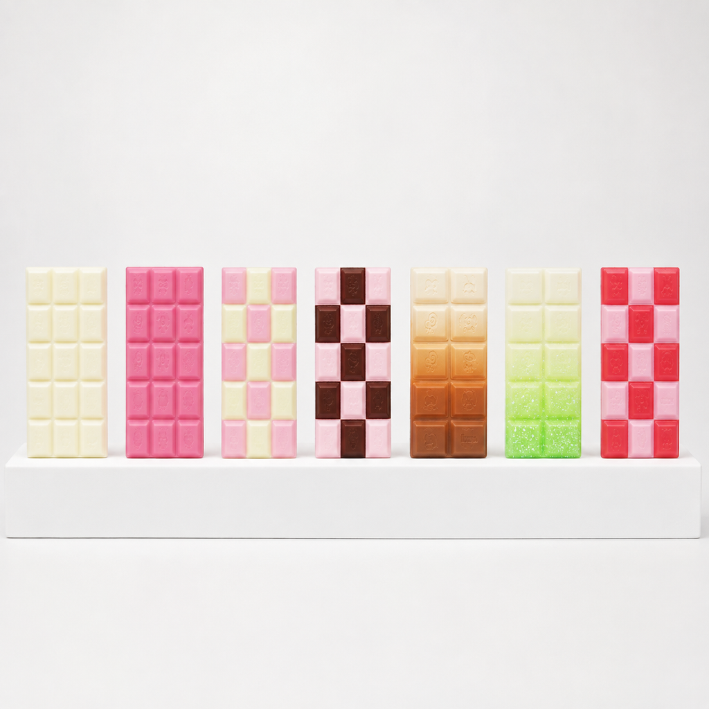 Seven upright chocolate-bar squishies in white, pink, brown, green and red designs