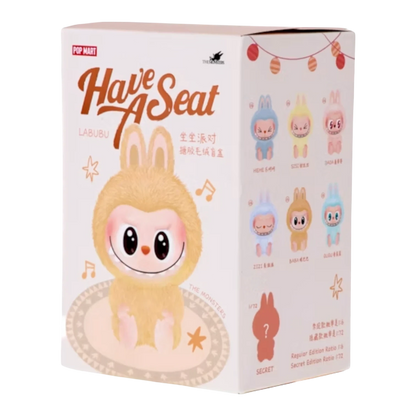 Squish Planet Pop Mart Labubu The Monsters Have a Seat Series blind box with a fuzzy yellow character on the front.